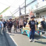IMG-20260706-WA0043 Babinsa Karangbesuki Amankan Kirab Gunungan, Wujud Sinergi Jaga Kelancaran Tradisi Budaya
