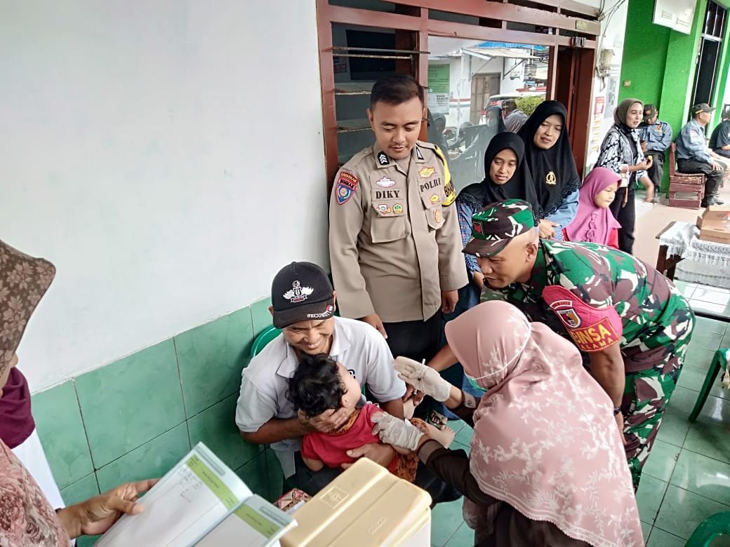 Babinsa Kotalama Turun Langsung Dampingi Posyandu, Dekat dengan Warga